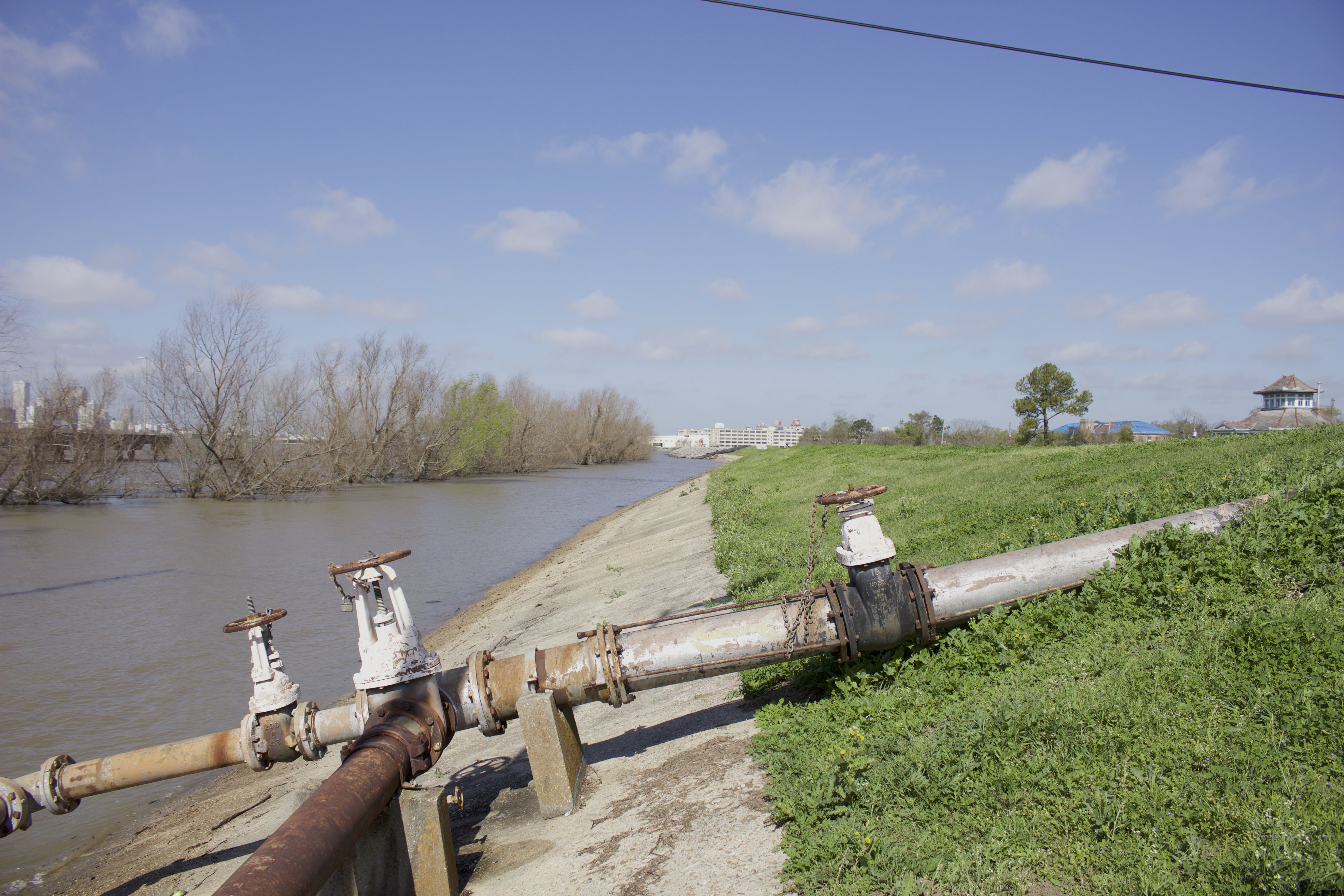 A levee separates the Mississippi River from the Lower Ninth Ward in New Orleans. Concrete at the base of the levee was added after Hurricane Katrina to prevent it from eroding.