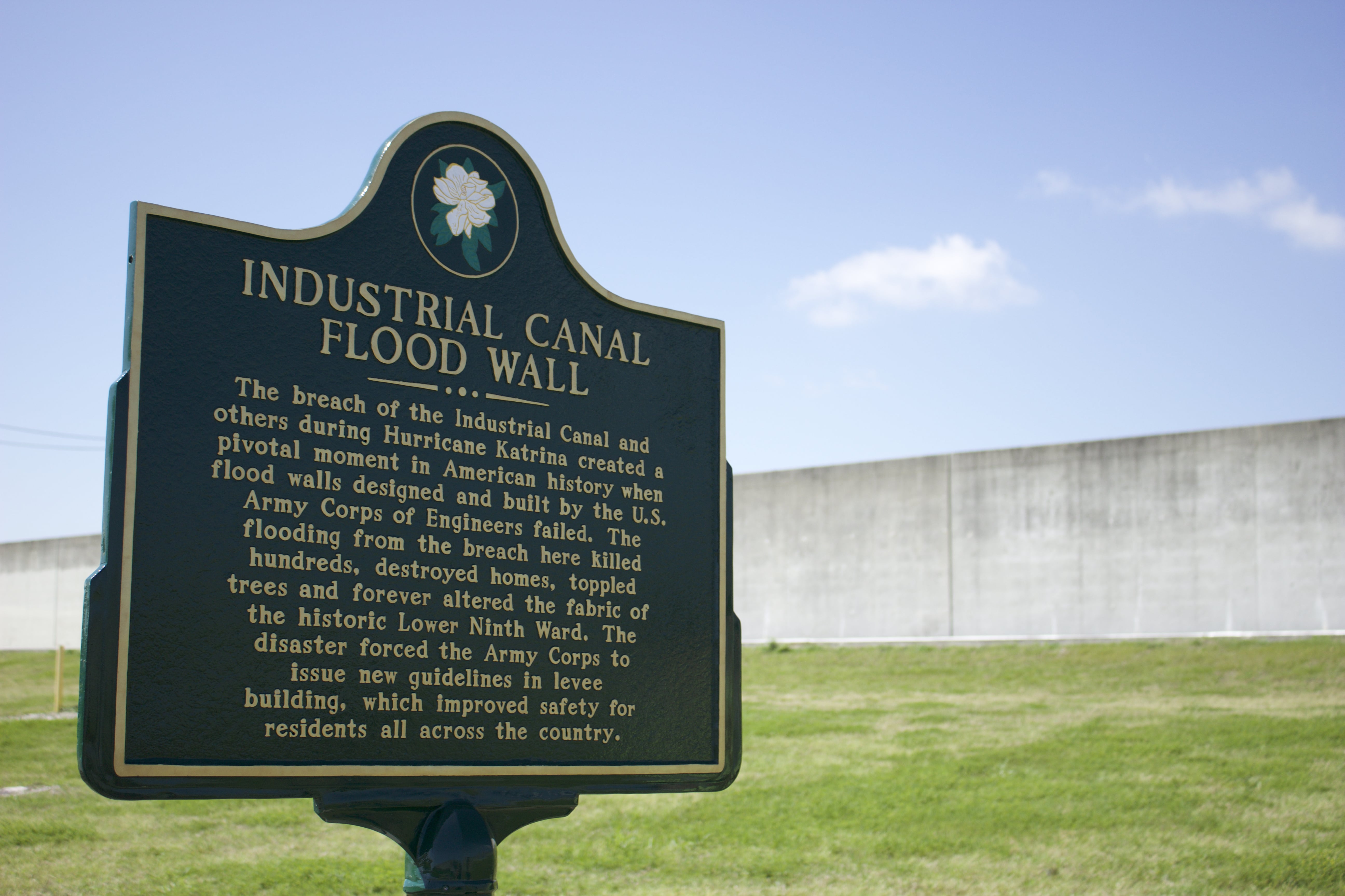 A Louisiana State historic plaque is displayed at the site of the Industrial Canal breach in New Orleans during Hurricane Katrina. The breach was especially devastating for the Lower Ninth Ward, decimating the primarily lower income community.