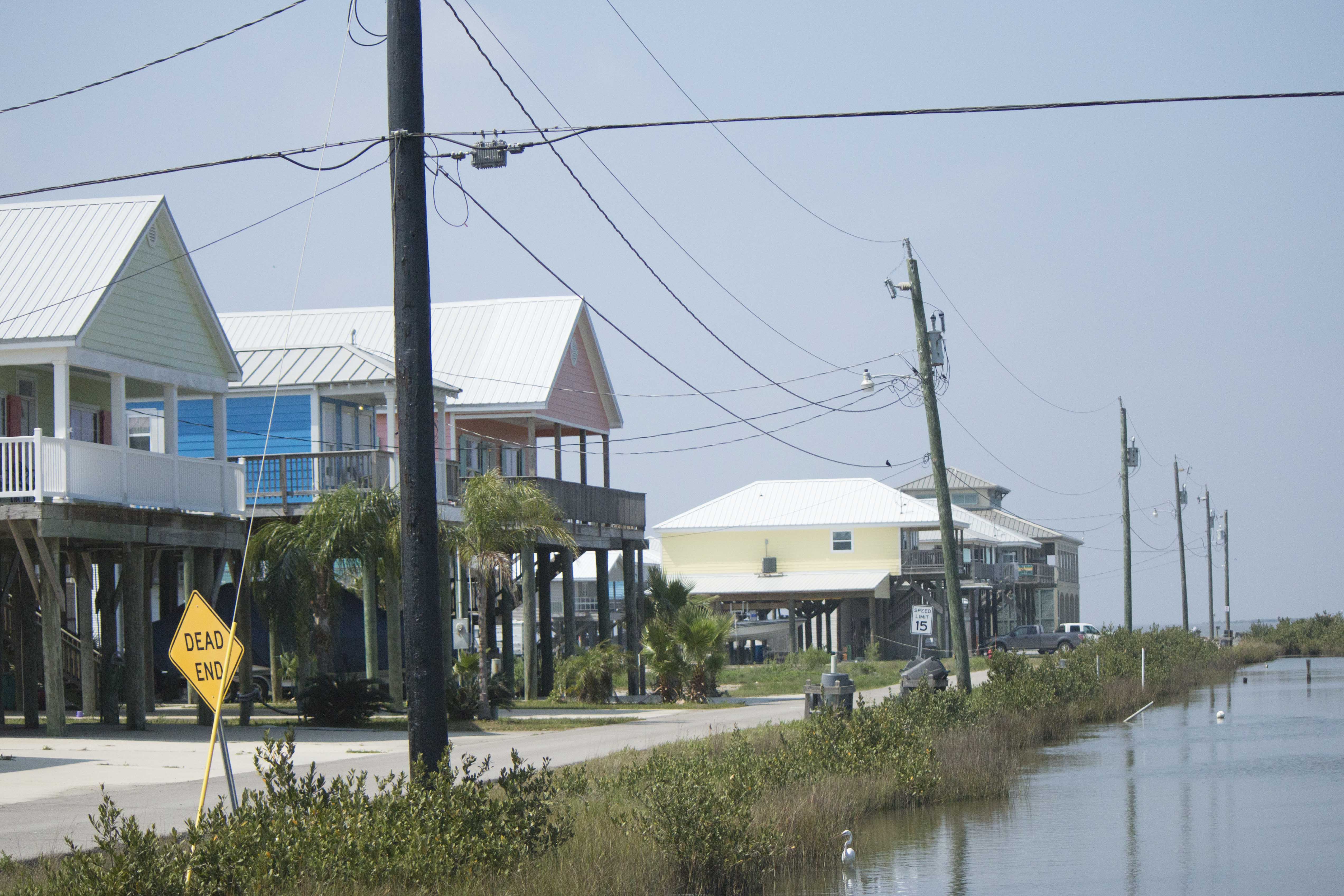 Homes in Grand Isle display stilts that have raised them an entire story off the ground to prevent flooding from coastal storms.  Grand Isle is the only inhabited barrier island on the Louisiana coast, and a destination for vacationers.